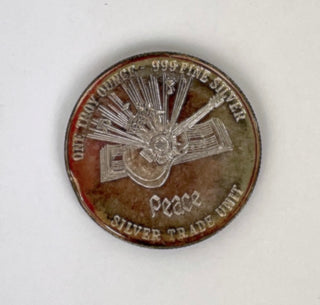 The Beatles. [Lennon, John. (1940–1980)] Group Lot including Secretarial Signed Photos and Silver Coin