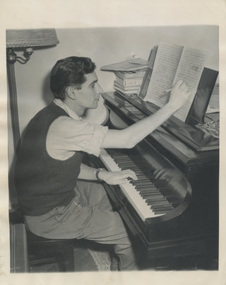 Bernstein, Leonard. (1918–1990) Photograph of the young composer at the piano, 1945