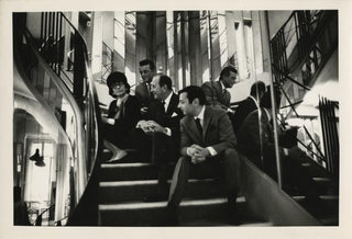 Chanel, Coco. (1883–1971) & Lerner, Alan Jay. (1918–1986) & Previn, André. (b. 1929) & Brisson, Frederick. (1912–1984) Two Original Photographs at the Chanel Salon