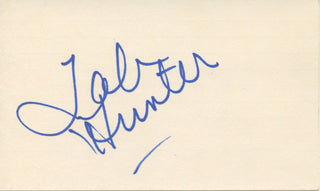 Divine [Milstead, Harris Glenn].  (1945–1988) & Hunter, Tab. (1931–2018) Autograph Signatures and "Polyester" Promotional Photograph