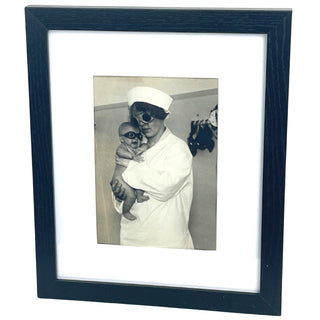 [Chemical Weapon Goggles] Aktuelle Bilder Centrale [Georg Pahl] Nurse and baby in protective gas goggles, [Germany], ca. 1930