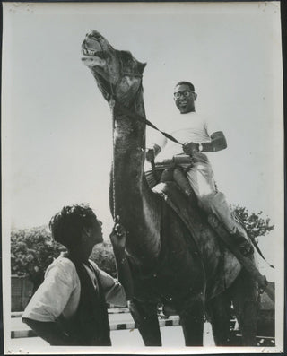 Gillespie, Dizzy. (1917–1993) Original Photograph Riding a Camel!