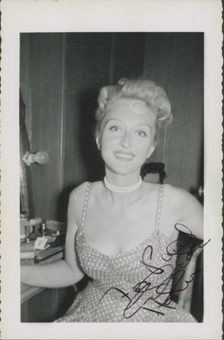 Holm, Celeste. (1917–2012) Pair of Signed Candid Photographs in Her Dressing Room