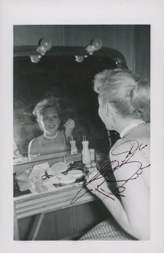 Holm, Celeste. (1917–2012) Pair of Signed Candid Photographs in Her Dressing Room