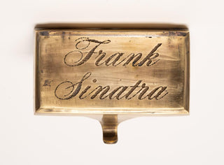 [Sinatra, Frank. (1915–1998)] Frank Sinatra's Engraved Brass Dressing Room Hook from Las Vegas, view 1